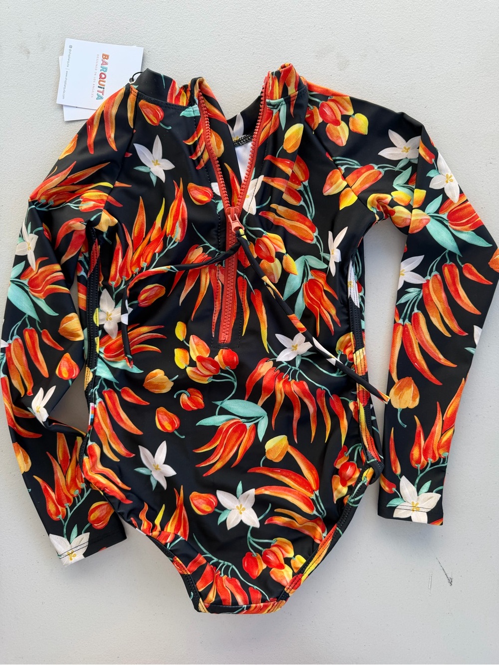 Kids Long-Sleeve Floral Tropical Swim Bodysuit in Black